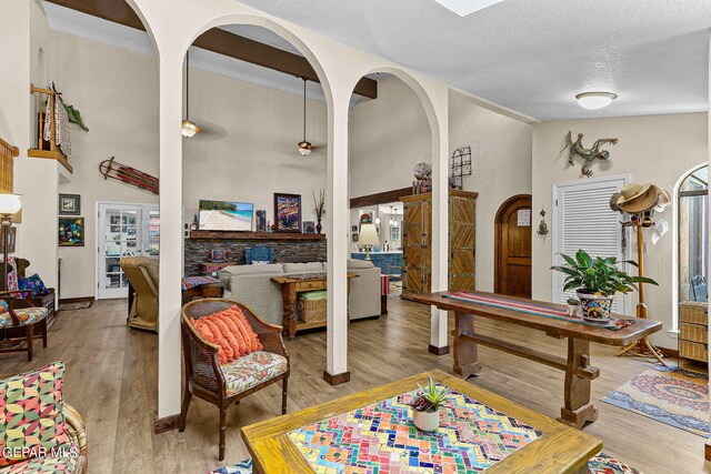 playroom with hardwood / wood-style floors and a textured ceiling