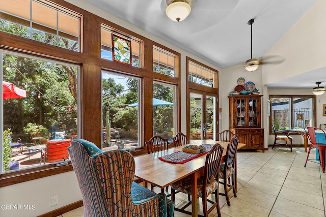 dining area featuring ceiling fan and light tile patterned flooring