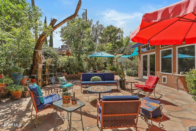 view of patio with french doors and an outdoor living space