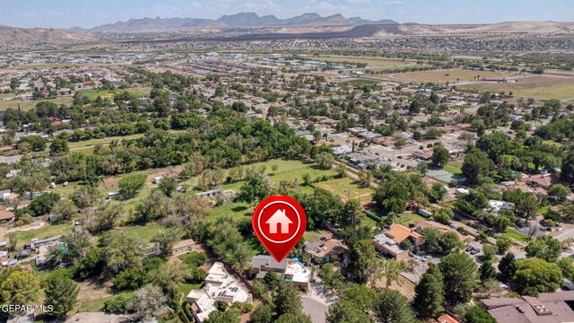 birds eye view of property with a mountain view