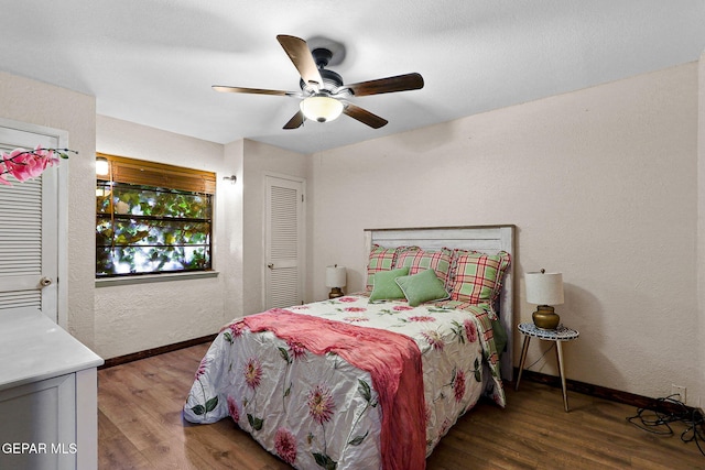630 Gary Ln, El Paso, TX 79922 - bedroom with wood finished floors, baseboards, a textured wall, and ceiling fan
