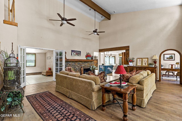 630 Gary Ln, El Paso, TX 79922 - living room featuring beam ceiling, ceiling fan, healthy amount of natural light, wood finished floors, and high vaulted ceiling