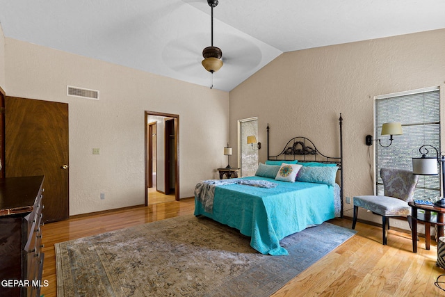 630 Gary Ln, El Paso, TX 79922 - bedroom featuring vaulted ceiling, wood finished floors, a textured wall, and ceiling fan