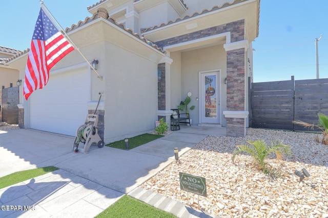 entrance to property featuring a garage