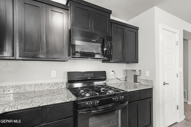 kitchen with carpet floors, black appliances, and light stone countertops