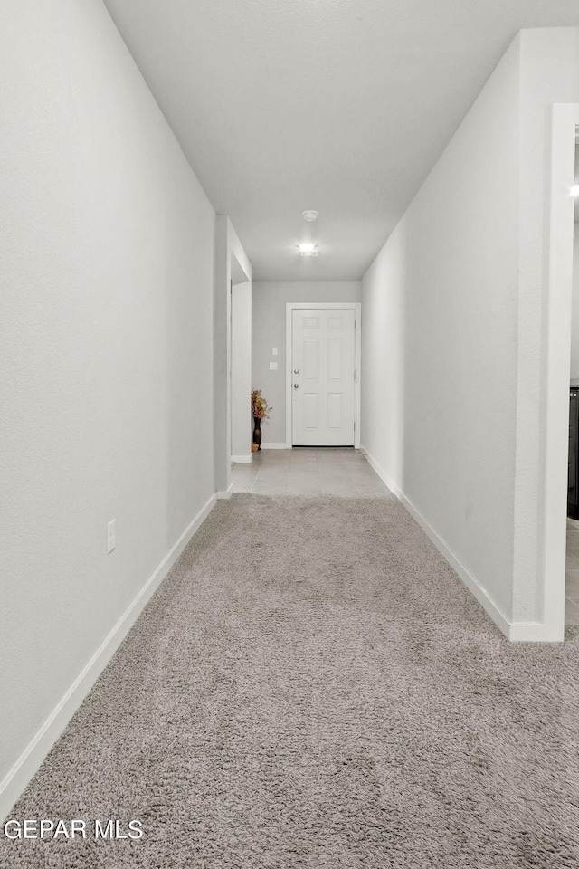 corridor with light colored carpet