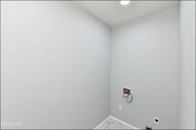 washroom featuring tile patterned flooring, hookup for a washing machine, and hookup for an electric dryer