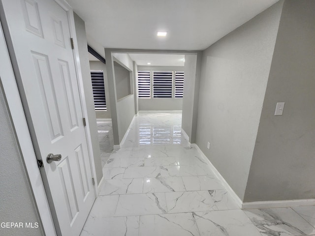 hallway featuring light tile patterned floors