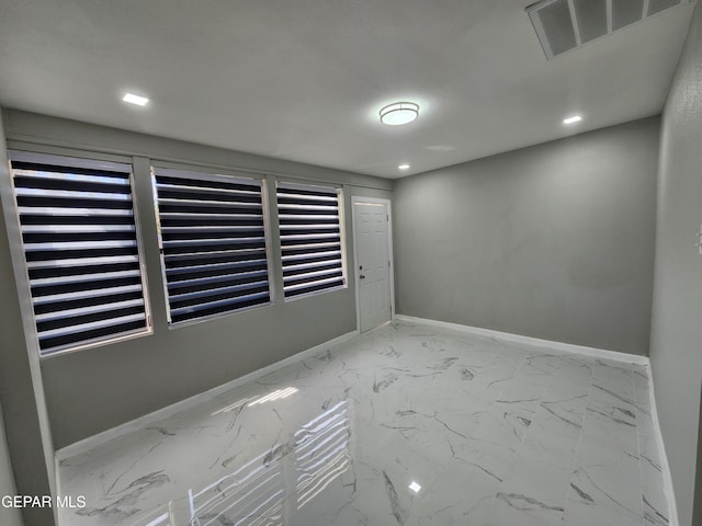 unfurnished room featuring tile patterned floors