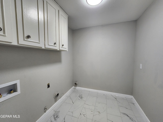 laundry room featuring gas dryer hookup, washer hookup, cabinets, hookup for an electric dryer, and light tile patterned floors