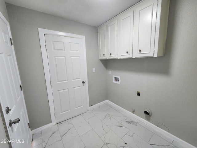 clothes washing area featuring gas dryer hookup, hookup for a washing machine, cabinets, electric dryer hookup, and light tile patterned floors