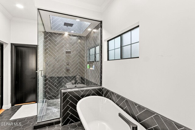 bathroom with ornamental molding, separate shower and tub, and tile patterned floors