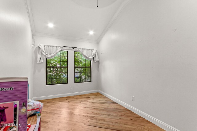 rec room with light hardwood / wood-style floors and ornamental molding