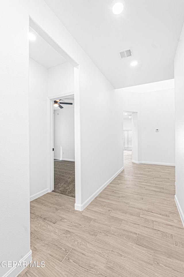 corridor featuring light hardwood / wood-style flooring