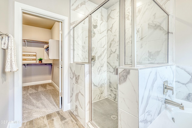 bathroom featuring hardwood / wood-style flooring and shower with separate bathtub