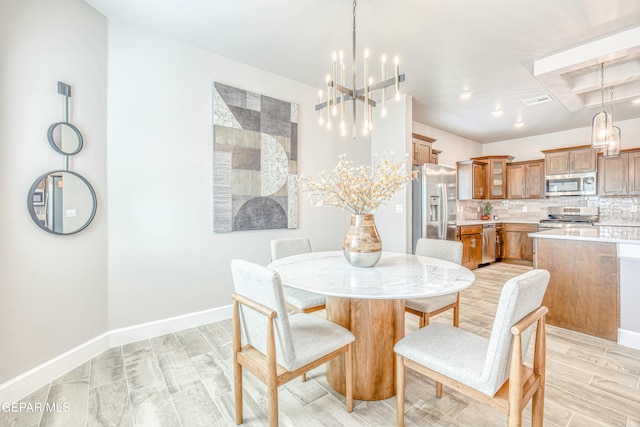 dining room featuring a chandelier and light hardwood / wood-style floors