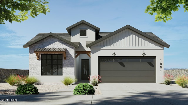 view of front of house with stone siding, board and batten siding, driveway, and a garage