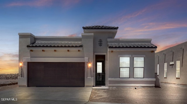 mediterranean / spanish-style house featuring a garage