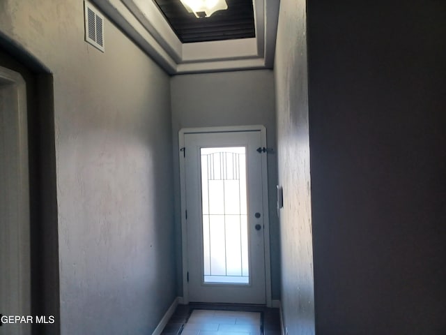 entryway with light tile patterned floors