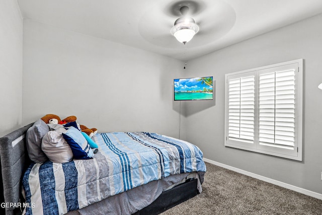 bedroom with ceiling fan and carpet flooring