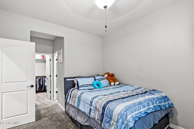 carpeted bedroom with a closet and ceiling fan