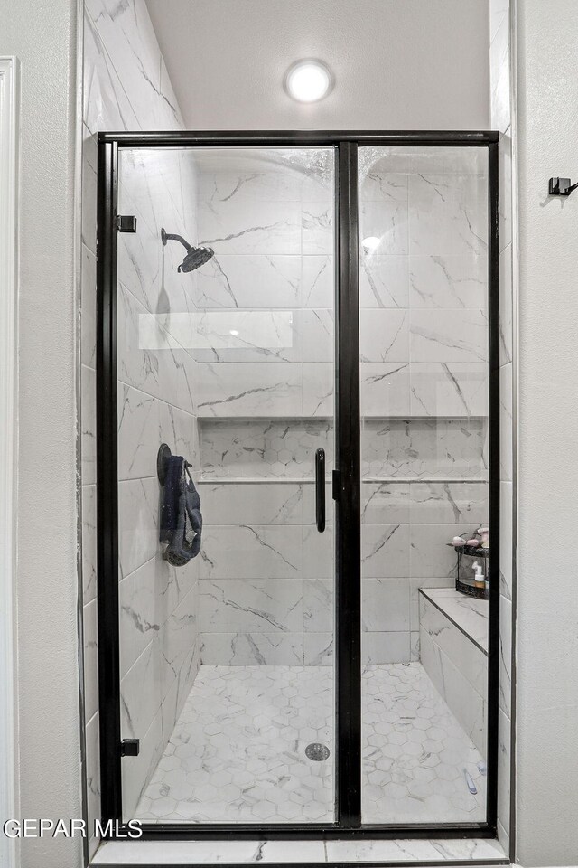 bathroom with an enclosed shower