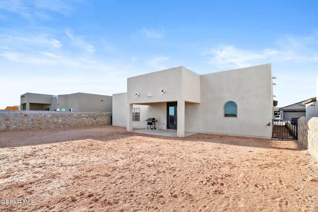 back of house featuring a patio