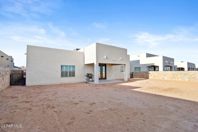 back of house with a patio area