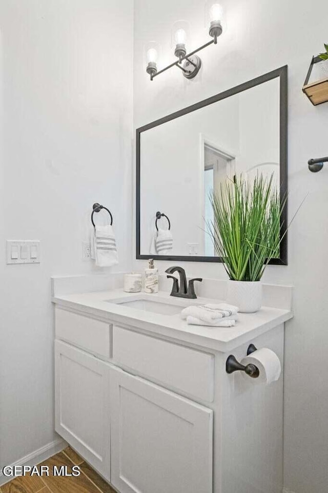 bathroom featuring vanity and wood finished floors