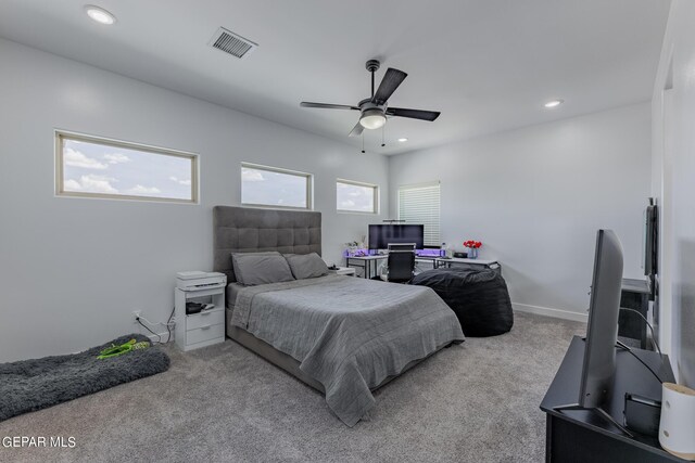 bedroom featuring light carpet and ceiling fan