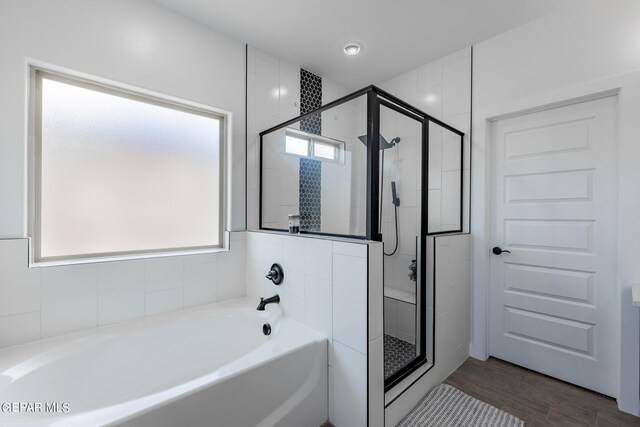 bathroom with separate shower and tub and hardwood / wood-style floors