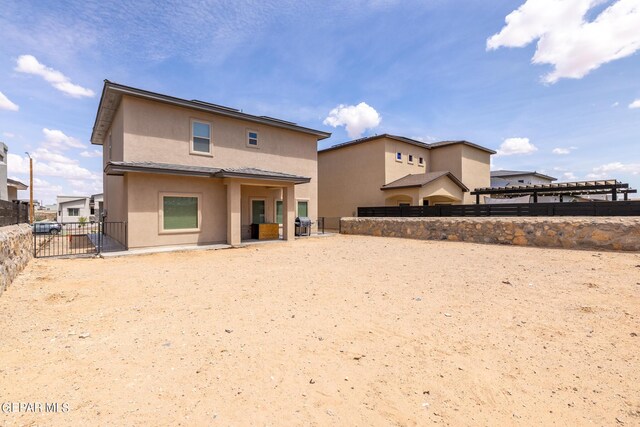 back of house with a patio area and a pergola