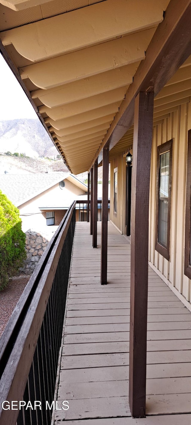 wooden deck with a mountain view