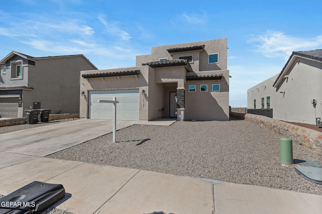 adobe home featuring a garage