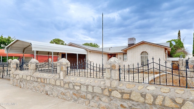 view of front of house with a garage and a carport