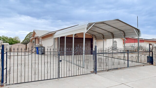 view of gate featuring an outdoor structure