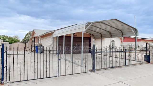 view of gate with fence