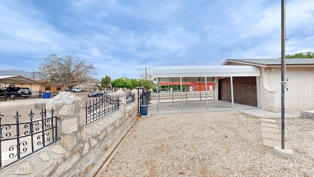 exterior space with a garage and fence