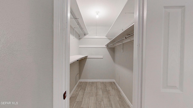 walk in closet featuring light wood-type flooring