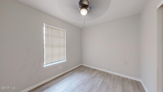 spare room featuring ceiling fan and light hardwood / wood-style floors