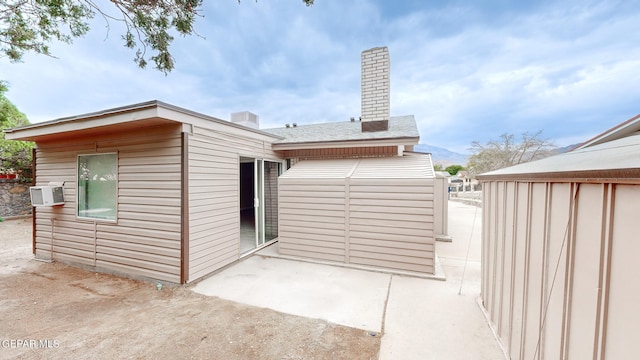 back of property with a patio area