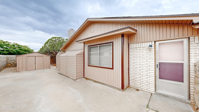 exterior space with a patio area and a storage unit