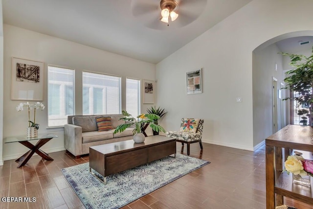 living room featuring ceiling fan, vaulted ceiling, and hardwood / wood-style floors