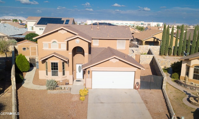 view of front of property featuring a gate, a residential view, driveway, and stucco siding