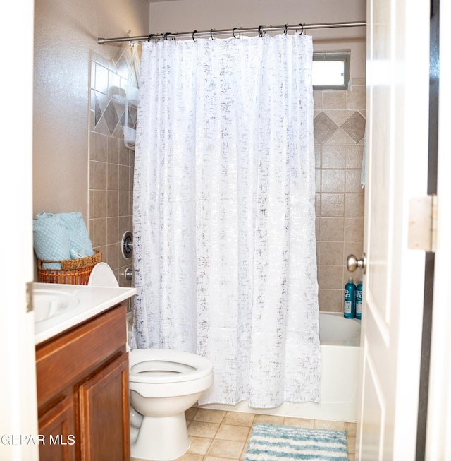 full bath featuring tile patterned flooring, vanity, toilet, and shower / tub combo with curtain