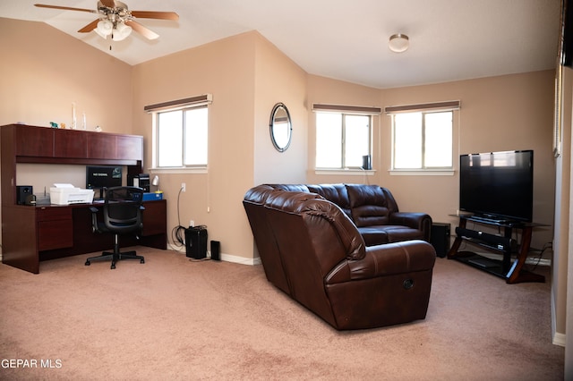 living room with light carpet, baseboards, lofted ceiling, and a ceiling fan