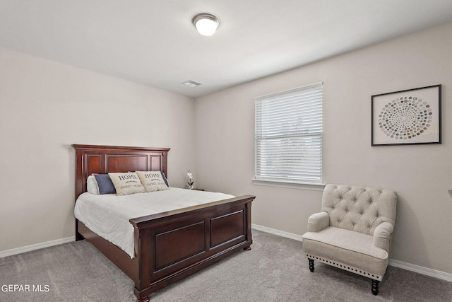 bedroom with light carpet