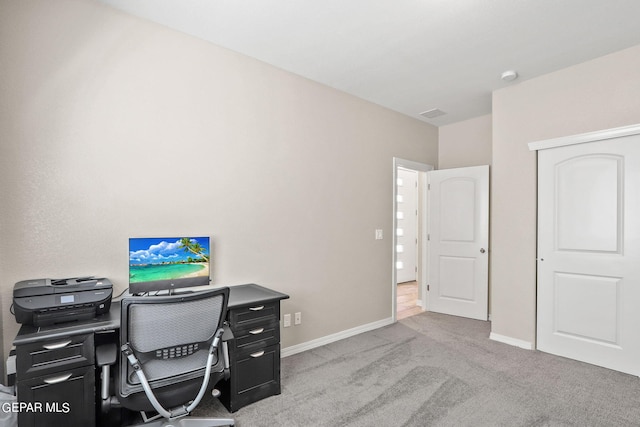 home office featuring light colored carpet