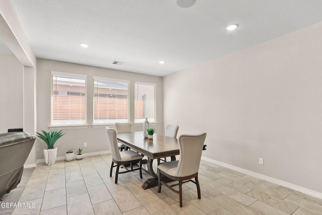 dining area with a textured ceiling