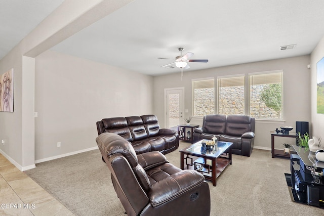 living room featuring ceiling fan and light carpet